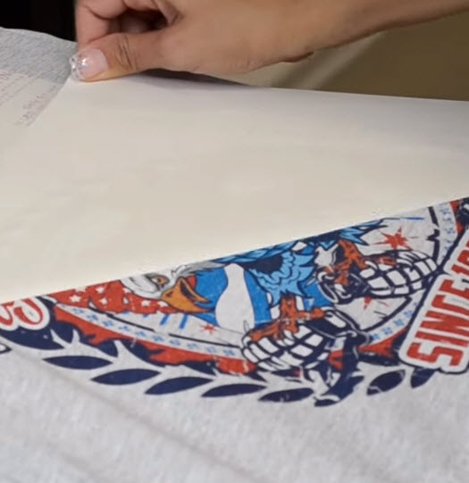 shirt being peeled with dtf film